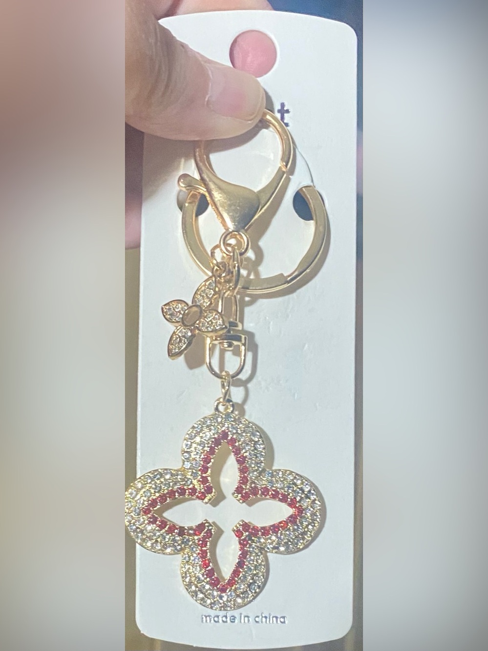 Bag charm/keychain gold-tone rhinestone-encrusted quatrefoil or clover motif